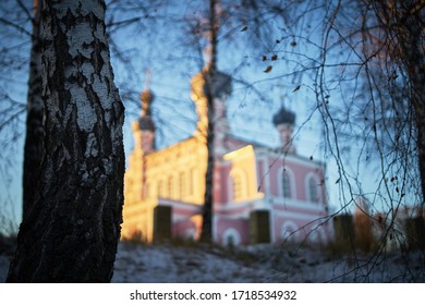 Warm Winter Landscape Of Sunset Blue Sky With Church On Background