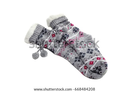 Warm, winter women's socks with a pattern close up on a white background  