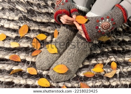 Warm woolen clothes. Close-up of warm mittens and socks.