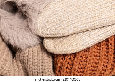 Warm Woolen Knitted Textiles And Socks In Beige, Pink And Orange Colors To Stay Warm During The Cold Winter Times And The Energy Crisis , Expensive Gas And Electricity Concept. Soft Colors