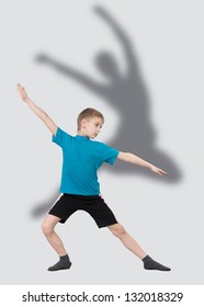 Warming up boy with dancer's silhouette behind him