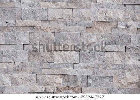 Warm-toned wall surface with light staining and a rough edge. Natural texture ideal for modern visual designs.