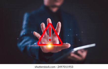 Warning alert icon concept. Programmer or developer use computer tablet to program access security caution alert triangle sign. Cybersecurity stop scam email online internet. Risk phishing fraud error