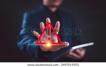 Warning alert icon concept. Programmer or developer use computer tablet to program access security caution alert triangle sign. Cybersecurity stop scam email online internet. Risk phishing fraud error