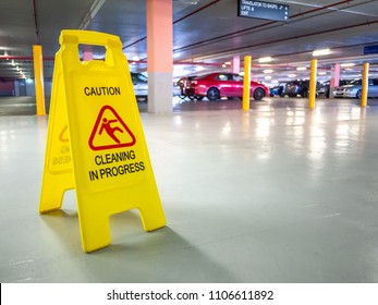 Warning Janitorial Sign Of Cleaning In Progress In Car Park To Warn Passersby For Safety.