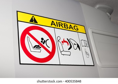 Warning label image and disabling key education airbag on the passenger side for transporting children - Shutterstock ID 400535848