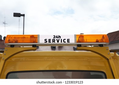 Warning Light Bar On The Roof Of A Car With The Inscription 24 Hour Service