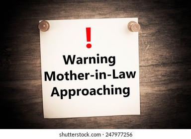 A Warning Of Mother In Law Approaching  Concept On Note Paper