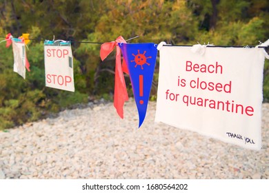 warning no entry sign at beach due to coronavirus epidemic quarantine