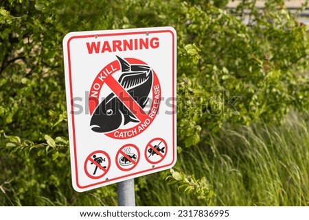 Warning. No kill. Catch and release. Sign to regulate fishing rules - fishing alowed.