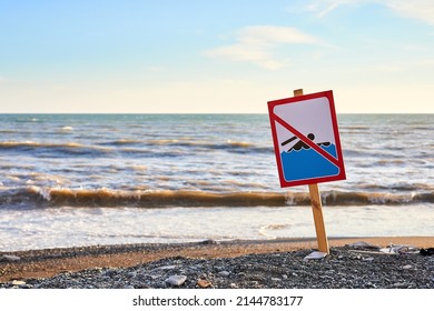 Warning No Swimming Sign With Strong Sea Wave By The Beach Background