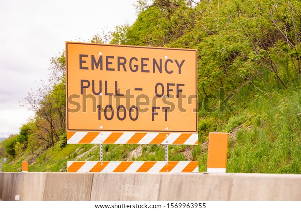 Warning road sign, Emergency pull off\
1000ft text message, highway in United\
states