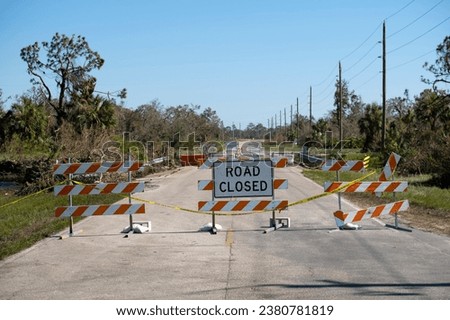 Warning roadworks sign and safety barrier on city street during maintenance repair work Stockfoto © 