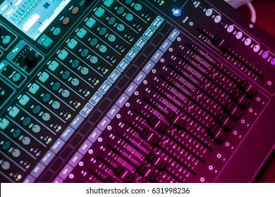 WARNING SHALLOW DEPTH OF FIELD EFFECT (small aperture) audio, a mixing console is an electronic device for combining (also called 