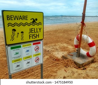 Warning Sign 'Beware Jellyfish' And Warning Sign For Safety Swiming With Swim Ring Or Life Ring.