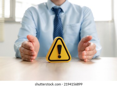 Warning sign in businessman's hand, Caution in investing Economic situation warning, Deflation and  inflation concept. - Shutterstock ID 2194156899