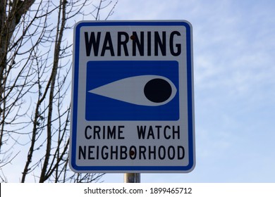 Warning Sign Crime Watch Neighborhood Against The Sky