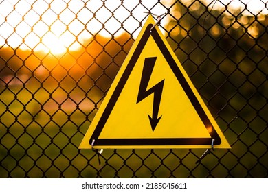 warning sign danger on the fence of the power plant close-up - Shutterstock ID 2185045611