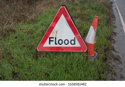 Warning Sign For A Flood On A Roadside In Rural Devon, England, UK