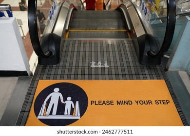 Warning sign on the escalator for safety - Powered by Shutterstock