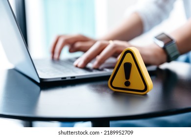 Warning sign on  table while businesswoman work, Network security, Dangerous information alert and incorrect data connection password concept.