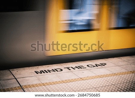 Warning sign for people to avoid falling between the platform and oncoming trains, taken on September 24, 2025, at Town Hall station, Sydney, Australia.