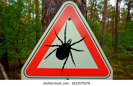 Warning Sign For Ticks In The German Woods.