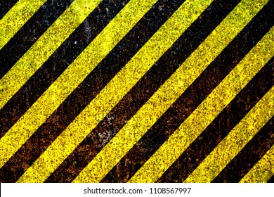 Warning sign yellow and black stripes painted over rusty metal plate as texture background. Concept for do not enter the area, caution, danger, hazard. - Shutterstock ID 1108567997