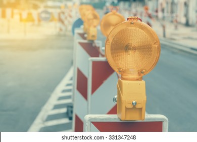 Warning Signs For Work In Progress On Road Under Construction. Vintage And Retro Style And Shallow Dof