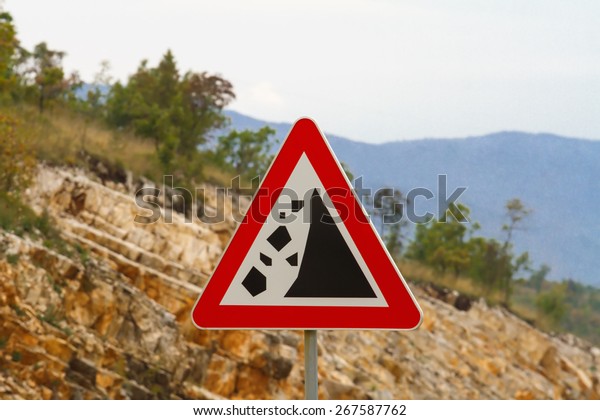 Warning Stone Fall Road Sign On Mountain\
Road\
Road sign warning about\
rockfall
