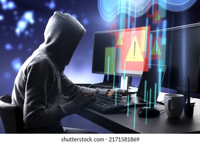 Warning system and cyber attack concept with side view on hacker in hoody working on computers and virtual data cloud network interface with exclamation point
