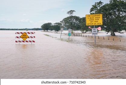 Warnings About High Water Signs On A Flooded Road In Texas. The Aftermath Of Hurricane Harvey, USA                       