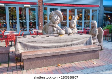 Warrington, UK - October 27, 2019 - 'Tea Party' Sculpture Depicting Four Lewis Carroll Characters - Alice, The Mad Hatter, The Sleepy Dormouse And The March Hare In Golden Square, Warrington, Cheshire