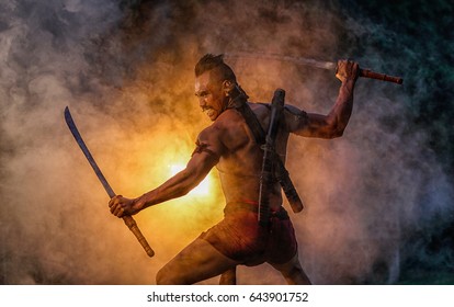 [warrior man ] Thai ancient warriors with long buffalo, use the sword to fight .