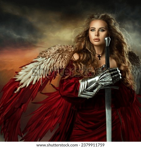 Warrior Woman with Sword. Medieval Female Knight in Armor. Beautiful Viking Girl as Battle Goddess with Wings in Red Fantasy Dress over Sky Background