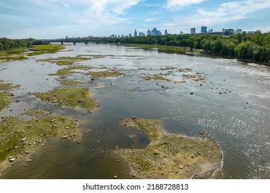 Warsaw city panorama over the Vistula river in summer time with low water level
