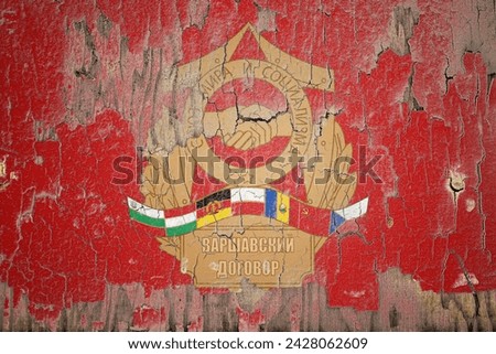 Warsaw Pact flag and paint cracks. Prison concept with border image. Warsaw Pact is currently heading toward recession. Inflation. employment. economic recession. Double exposure hologram