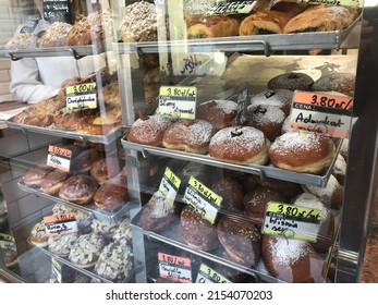 Warsaw, Poland, 10 October 2019: Donut Shop Street Window Display In Old Town Market Square Warsaw, Poland With Fried Doughnuts Donut, Slivered Almonds Bread Pastry In Autumn