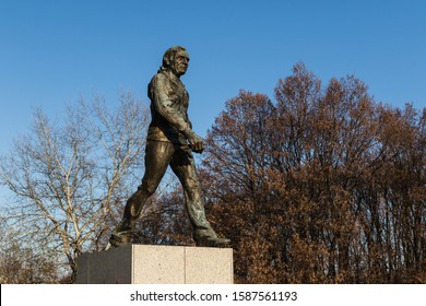 Warsaw Poland, 11/6/19: Statue Of The Polish Coach Kazimierz Gorski On The Pedestal Among Trees.