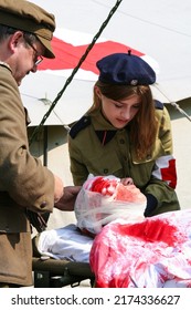 Warsaw, Poland - 15 august 2008: Dressing wound of injured soldier in staging of World War I field hospital