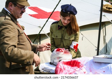 Warsaw, Poland - 15 august 2008: Dressing wound of injured soldier in staging of World War I field hospital