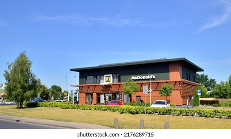 Warsaw, Poland. 27 June 2022. McDonald's Fast Food Store In City. Brown Colour Facade. No People Near Building. 