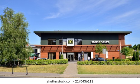 Warsaw, Poland. 27 June 2022. McDonald's Fast Food Store In City. Brown Colour Facade. No People Near Building. 