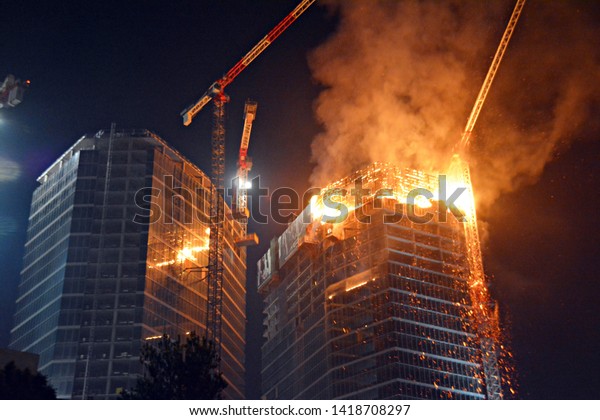Warsaw, Poland. 7 June\
2019. A fire at the Warsaw Hub construction site. Fire in a\
high-rise building. 