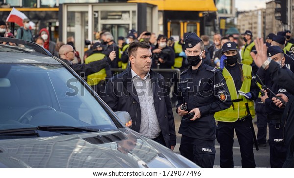 Warsaw, Poland 7.05.2020: protest of dissatisfied\
businessmen in the center of Warsaw - protest leader Michal\
Wojciechowski talks to the\
police
