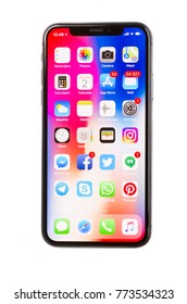WARSAW, POLAND - DECEMBER 02: New Iphone X Mobile Phone With Apps Over White Background