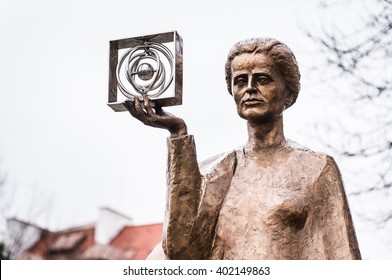 WARSAW, POLAND - JANUARY 2, 2015: Sculpture of Marie Sklodowska-Curie by polish sculptor Bronislaw Krzysztof. The Nobel prize winning scientist is holding a graphic symbol of Polonium in her hand.