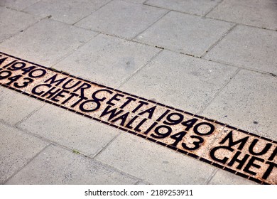 Warsaw, Poland - Jul 19, 2022: Street Mark Where The Warsaw Ghetto Wall Was Laid Out By The Nazis During German Occupation Of Poland. Warsaw Ghetto Was The Largest Jewish Ghetto In Europe.