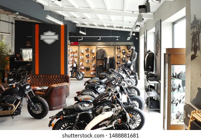 Warsaw, Poland - July 16, 2018: Motorcycles lined  up inside a Harley Davidson store by merchandise for 
sale in Warsaw, Poland. 