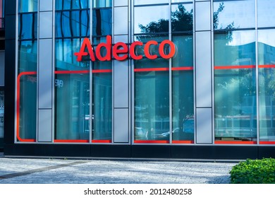 Warsaw, Poland - July 2021: Company signboard Adecco on the branch office of The Adecco Group.